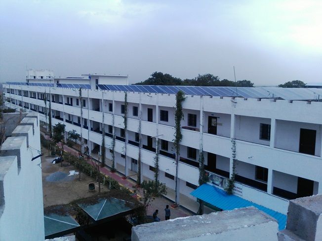 Mounting structure carrying panels on the roof of an institutional building.