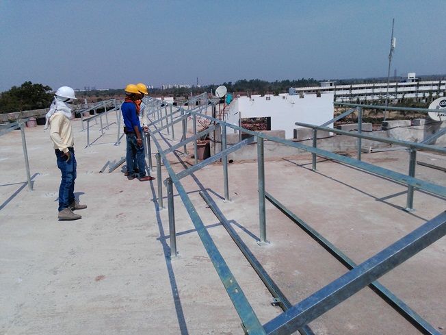Galvanised steel mounting structure being assembled on site.